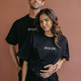 Couple wearing the black "Good Girl" relaxed fit embroidered T-shirt by WNGSPN, styled as elevated romance reader apparel.