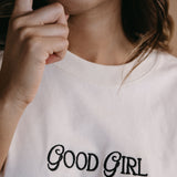 Close-up embroidery detail of the "Good Girl" relaxed fit T-shirt by WNGSPN, highlighting clean, minimalist embroidery.