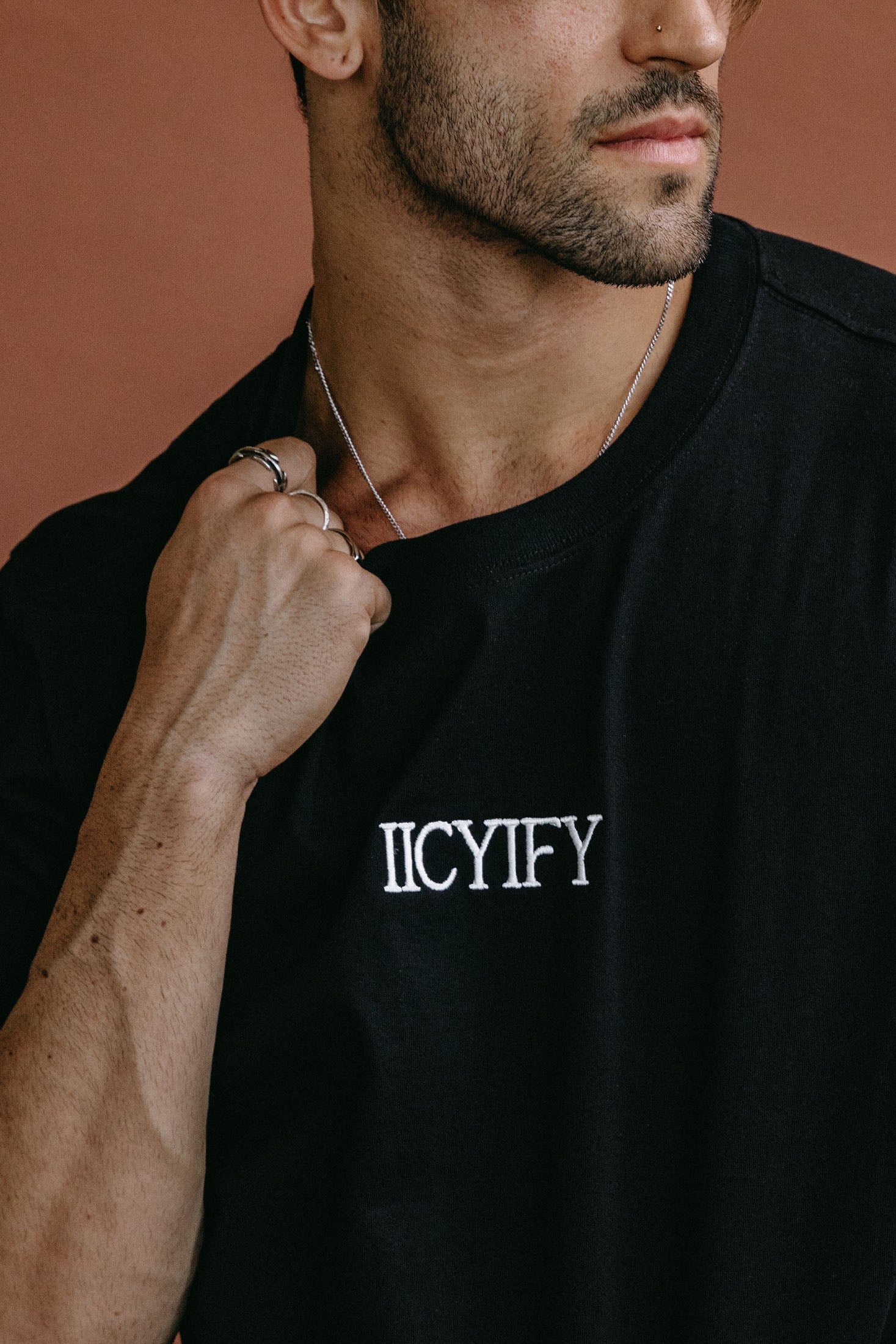 Close-up embroidery detail of the "Iicyify" relaxed fit T-shirt by WNGSPN, highlighting clean, minimalist embroidery.