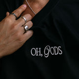 Close-up embroidery detail of the "Oh Gods" relaxed fit T-shirt by WNGSPN, highlighting clean, minimalist embroidery.