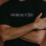 Close-up embroidery detail of the "Who Did This To You" relaxed fit T-shirt by WNGSPN, highlighting clean, minimalist embroidery.